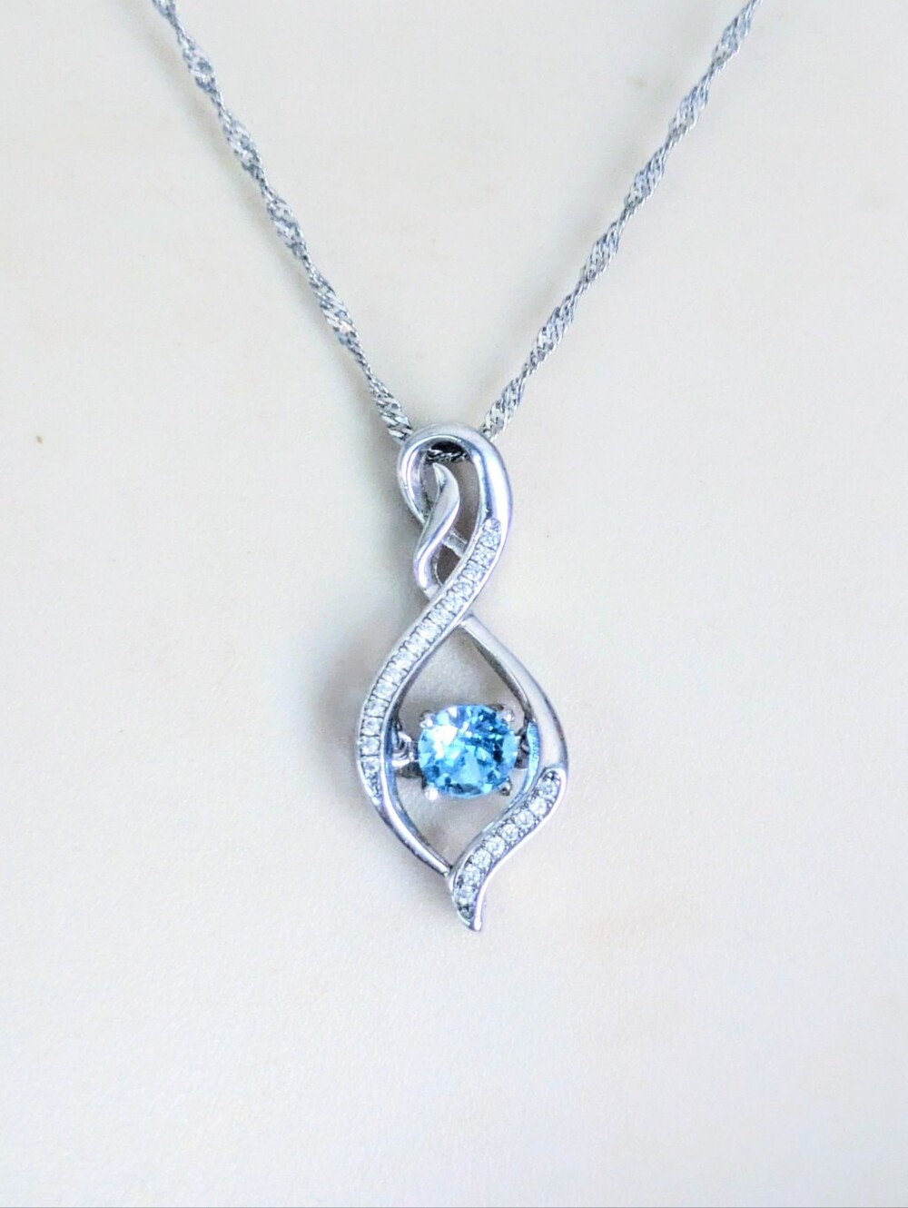 Sterling Silver Shimmering Blue Topaz Gemstone Infinity Pendant Necklace ZALES